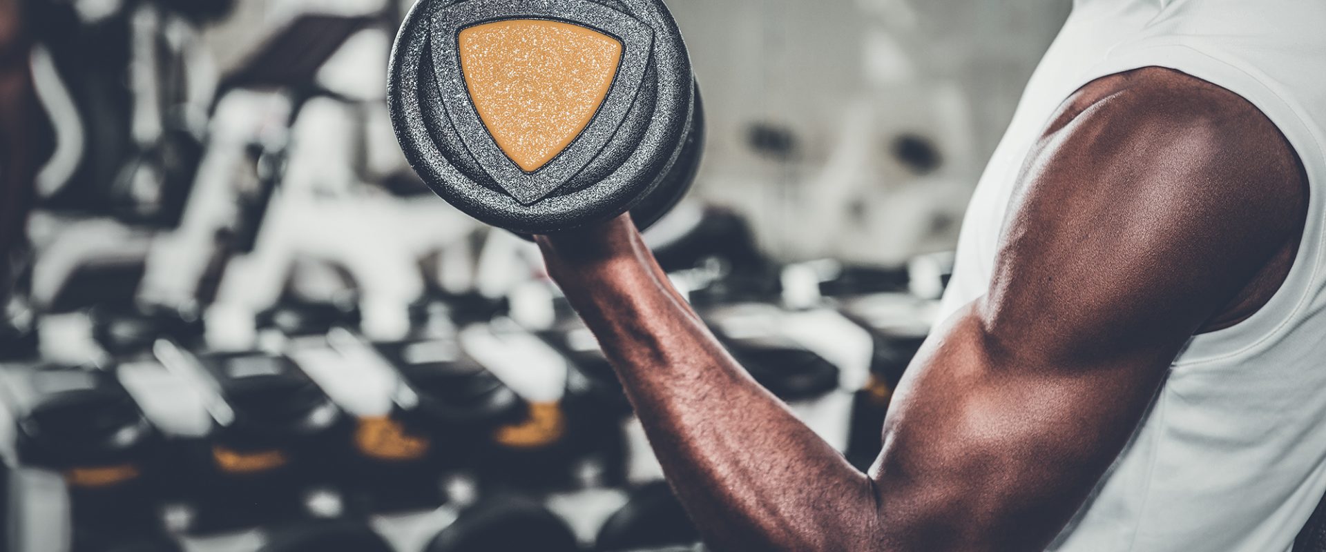 Lifting Weights in the Gym at The Residences at Omni Louisville Apartments in Louiseville, KY